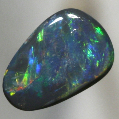 SOLID BLACK OPAL Orange to green with a hue of blue. SEE VIDEO